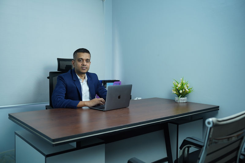 The company's consultant at his desk